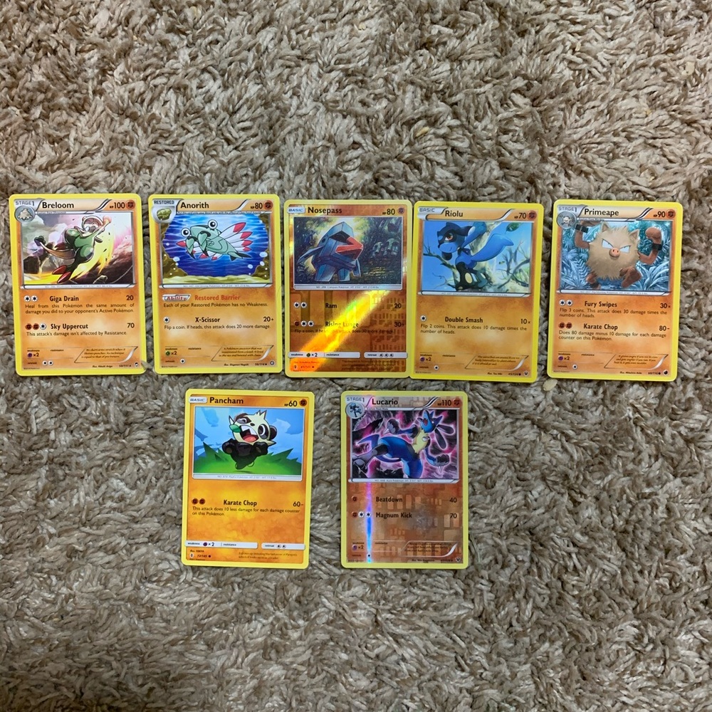 7 fighting type Pokémon cards.